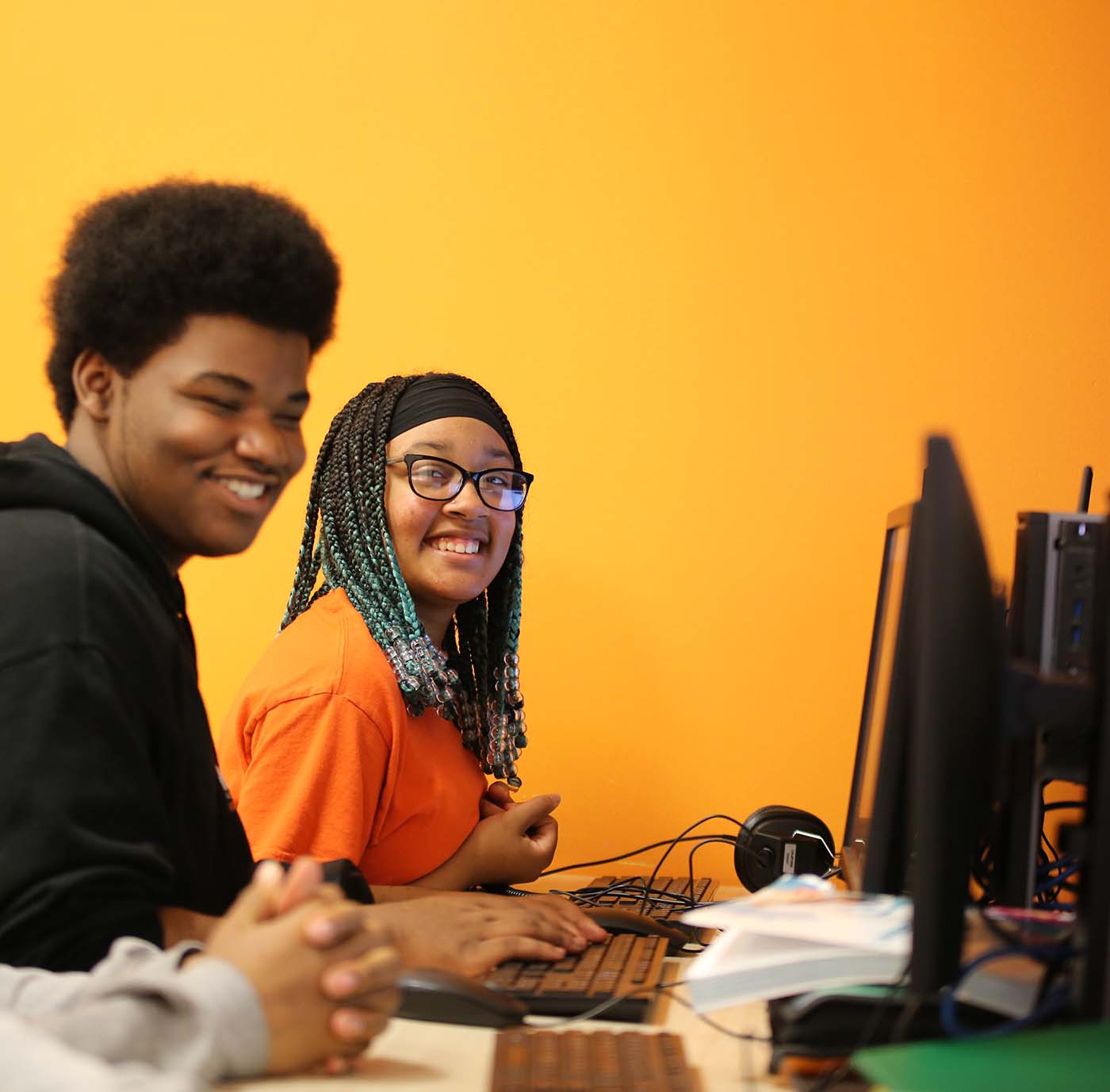 Horizon Science Academy Dayton High student drawing at a desk in a classroom setting