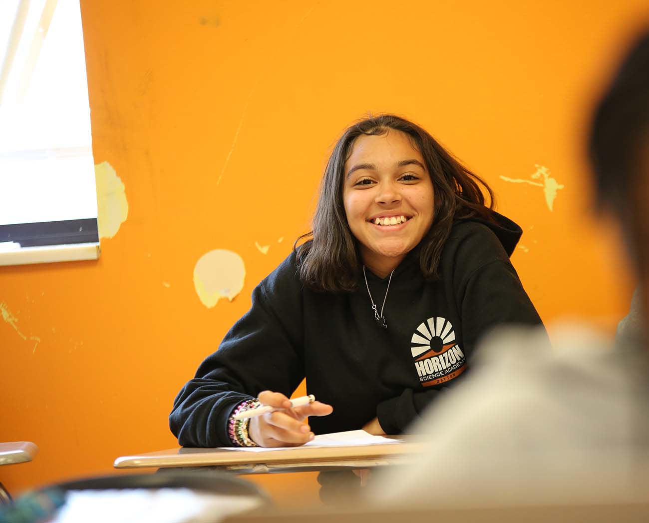 Smiling children together outdoors.